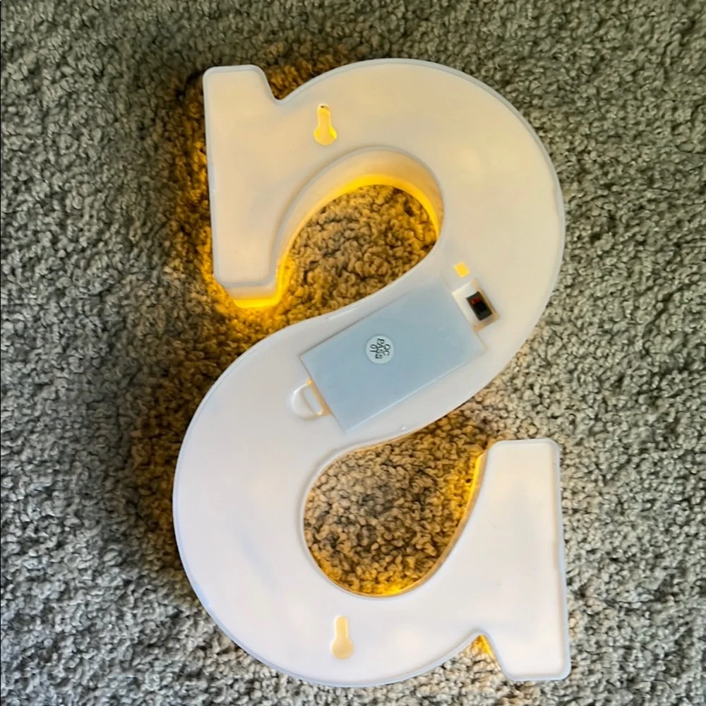 Illuminated White Letter 'S' Marquee Light